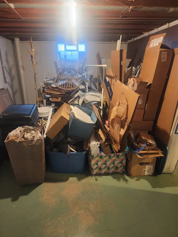 Roll-off dumpster container at job site for Cleanout Dumpster Rental in Oskaloosa